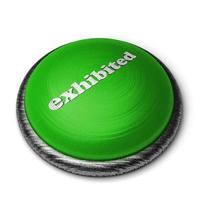 exhibited word on green button isolated on white photo