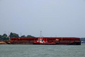 Various ship activities at the Port of Sri Bintan Pura in the city of Tanjung Pinang namely on the west coast of the island of Bintan photo