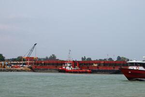 Various ship activities at the Port of Sri Bintan Pura in the city of Tanjung Pinang namely on the west coast of the island of Bintan photo