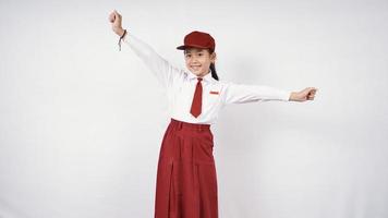 Pretty happy elementary school girl isolated on white background photo