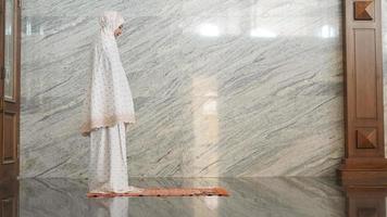 Asian Muslim women praying at the mosque photo