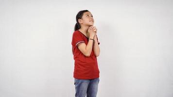 Asian little girl pleading wish isolated white background photo