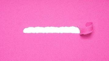 peel away pink paper to reveal hidden copy space underneath photo
