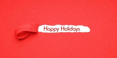 happy holidays peel away red paper background to reveal christmas greeting photo