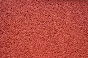 red roughcast background texture photo