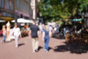 defocused pedestrian shopping street photo