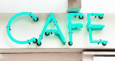 cafe neon sign in blue green photo