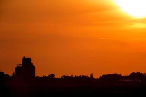 Sunset Sillouette with Grain Elevator photo