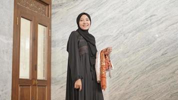 Muslim woman after worship at the mosque photo