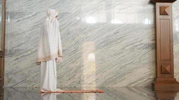 Asian Muslim women praying at the mosque photo