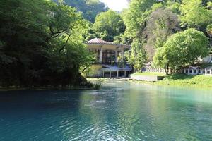 New Athos, Abkhazia. June 02, 2021. Beautiful  view of  pond and garden photo