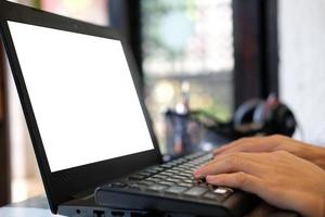 Close-up hand of a woman freelancing working, trading, and typing on a laptop with a graph at home, stock market and finance cryptocurrency trade concept. photo