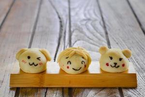 Thai style Mochi cartoon shape on wooden plate with copy space for your text. photo