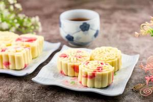 Close up, Homemade bakery concept. Delicious pineapple cookies look like mooncake on white plate with copy space. photo