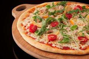 pizza on a wooden tray photo