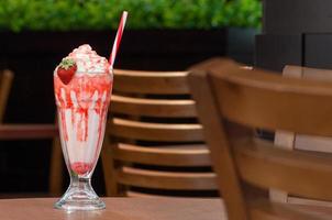 cold cocktail in a glass with a straw photo