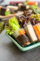 Healthy food concept. Salad roll made from fresh lettuce, seaweed, crab stick, and Vietnamese chicken wrap with rice vermicelli served with dipping sauce.
