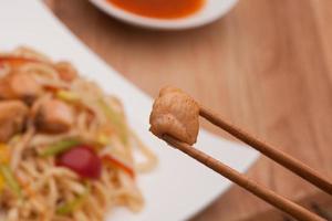 chopsticks with meat photo