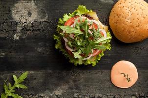 cheeseburger on a wooden surface photo