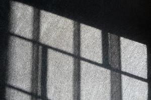 Light and shadows of window steel. Jail, prison, catch, control, limit, arrest, confusing, no way out concepts. photo
