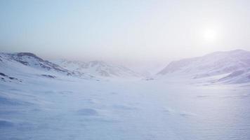 Aerial Landscape of snowy mountains and icy shores in Antarctica video