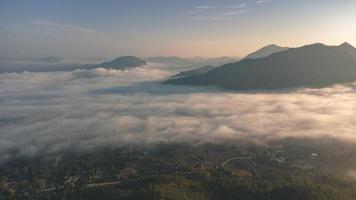 Sea of Fog covers the area on the top of hill Doi Phu Thok, Chiang Khan, Loei, Thailand with background of sunrise on winter. photo
