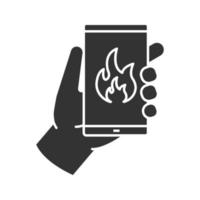 Fire emergency calling glyph icon. Hand holding smartphone with flame. Silhouette symbol. Negative space. Vector isolated illustration