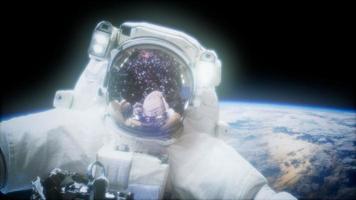 Astronaut at spacewalk. Elements of this image furnished by NASA video