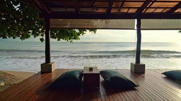 bean bag on balcony with sea beach background at sunrise or sunset time video