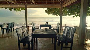 empty wooden chair with beach sea background video