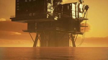 old oil platform during sunset in ocean video