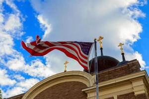 American flag and old church steeple reflect separation of state photo