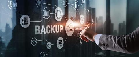 Backup Storage Data Technology concept. Businessman touching Backup photo