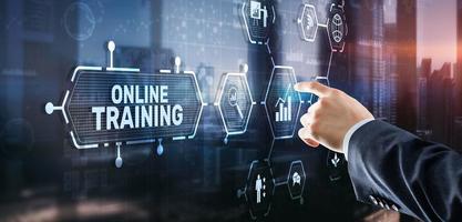 Online Training concept. Business Hand pressing OT inscription photo