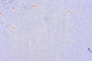 Texture of a metal wall with cracks and scratches which can be used as a background photo