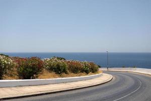 Automobile road by the sea on a sunny day in Malta photo