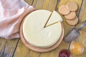 Traditional cheesecake on the wooden table photo