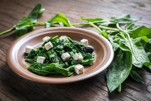 Spinach with cheese, olives