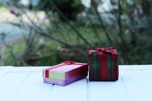 gift box on wooden white table backgrounds photo