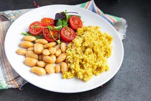couscous with beans and salad tomato vegetables fresh portion healthy meal photo