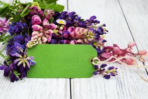 Lupine flowers on a  table photo