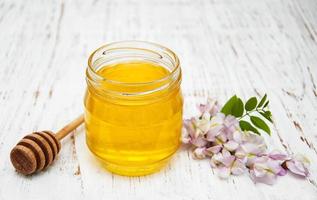 honey with acacia blossoms photo