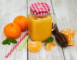 Jar with orange juice photo