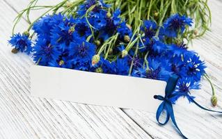 paper tag with  cornflowers photo