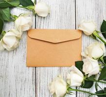 White roses and envelope photo