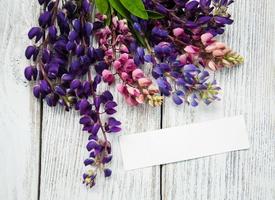 Lupine flowers on a  table photo