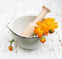 calendula flowers on table photo