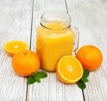 Jar with orange juice photo