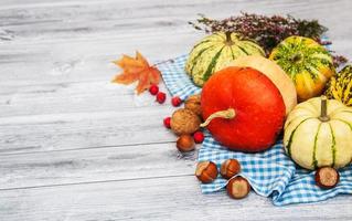 Pumpkins with autumn leaves photo