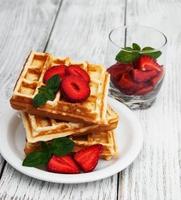 belgian waffles with strawberries and mint photo